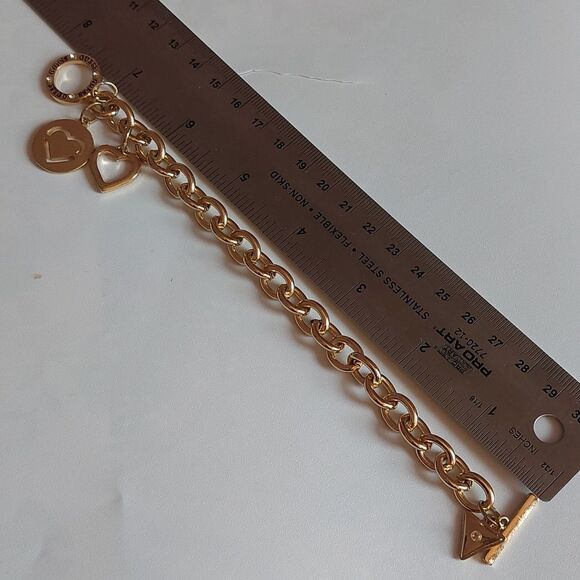 GUESS Gold Tone Heart Paved and  Logo Charms Toggle Clasp Bracelet - Picture 5 of 5